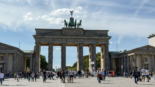 Group of people in front of historic building