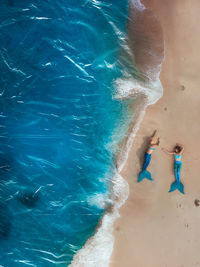 High angle view of woman swimming in pool