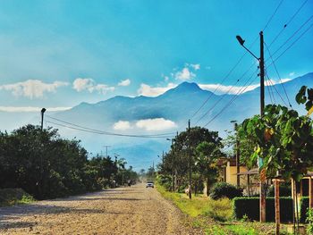 View of road against cloudy sky