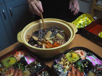 High angle view of person preparing food on table