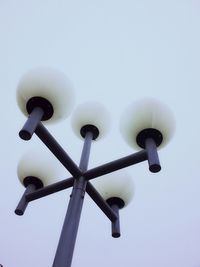 Low angle view of communications tower against sky