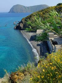 Scenic view of sea with mountain in background