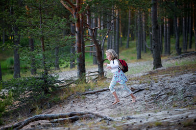 Girl running in forest