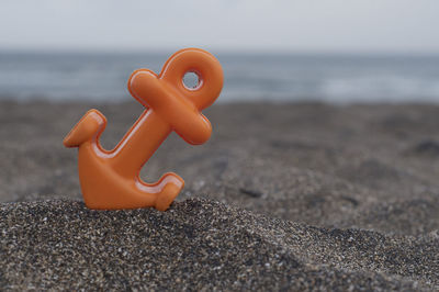 Close-up of toy on beach