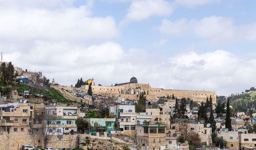 Buildings in city against sky