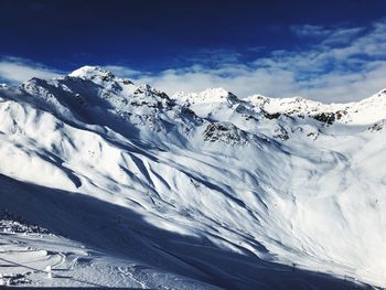 Scenic view of snowcapped mountains against sky