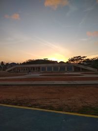 Building against sky at sunset