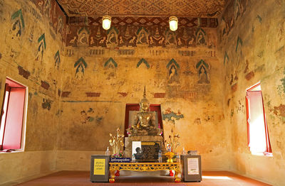 Interior of the old vihara of wat chomphuwek buddhist temple, national ancient monument in thailand