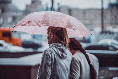 Rear view of woman with umbrella