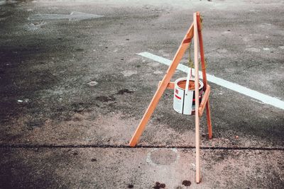 High angle view of broken sign on street