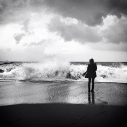 Scenic view of sea against cloudy sky