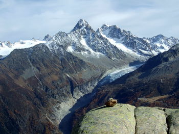 Scenic view of snowcapped mountains against sky