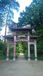 Low angle view of cross in temple against sky