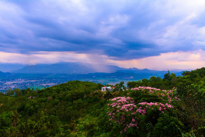 Scenic view of mountains against cloudy sky