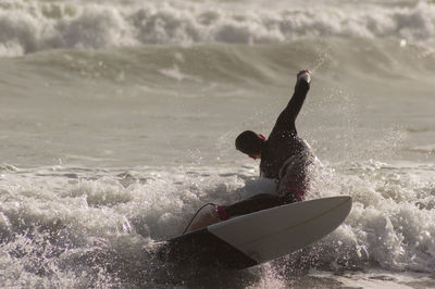 Man surfing in sea