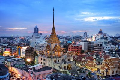 View of illuminated cityscape against sky