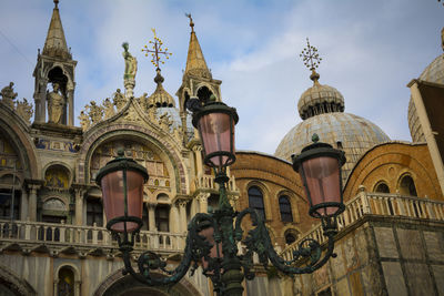 Detail view of saint mark's basilica in venice with street light in foreground