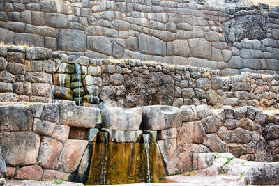 Flowing irrigation water at incan ruins of tambomachay