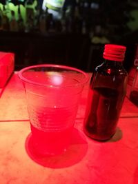 Close-up of red wine bottle on table