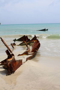 Shipwreck at sandy beach