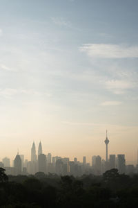 Vertical image of kuala lumpur cityscape in foggy morning