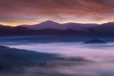 Scenic view of silhouette mountains against sky during sunset
