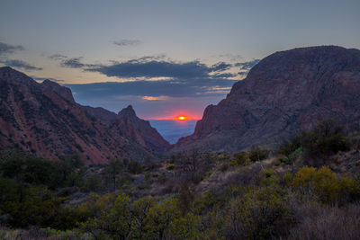 Scenic view of mountains against sky during sunset