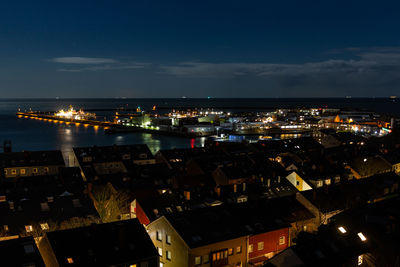 High angle view of illuminated buildings in city at night