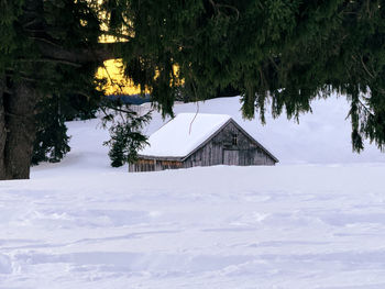 House on snow covered field