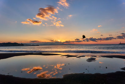 Scenic view of sea against sky during sunset