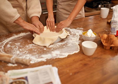 Midsection of man preparing food on table