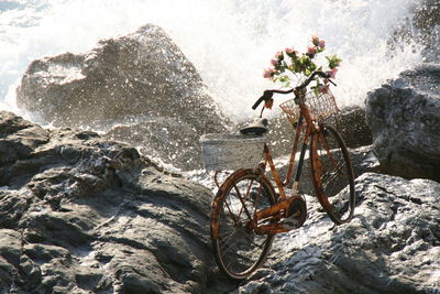 High angle view of bicycle on rocks at beach