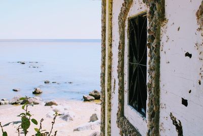 Close-up of abandoned beach against sky