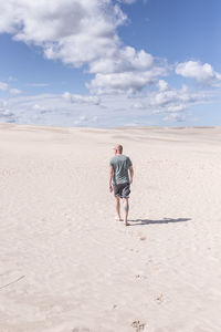 Full length of woman walking on beach