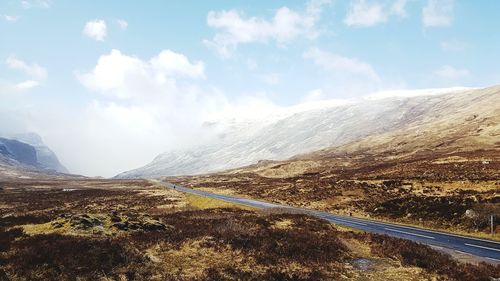 Scenic view of mountain road against sky