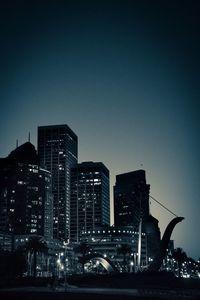Low angle view of skyscrapers lit up at night