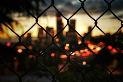 Full frame shot of chainlink fence during sunset