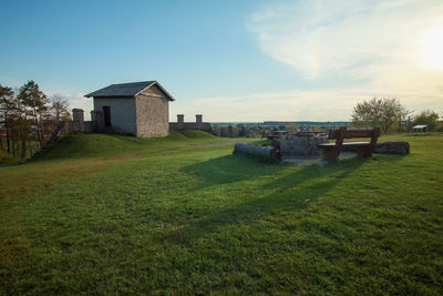 House on field against sky