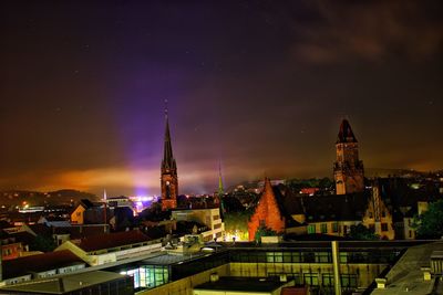 Illuminated buildings in city at night