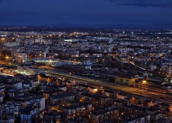 High angle view of illuminated cityscape against sky