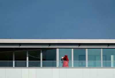 Woman standing against wall