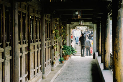 People in corridor of building