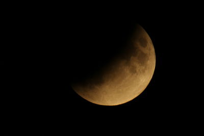 Low angle view of moon against sky at night