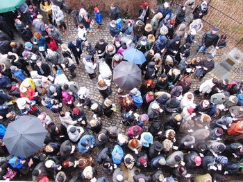 High angle view of people standing on street