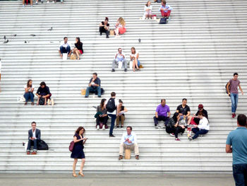 Group of people walking on staircase