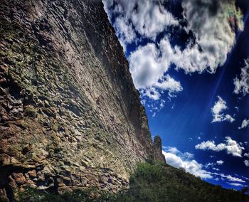 Low angle view of rock formations against sky