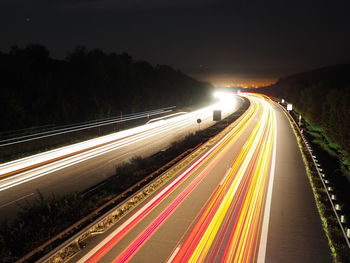 High angle view of light trails on street at night