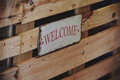 Welcome sign on wooden railing