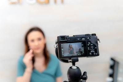 Portrait of woman photographing