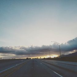 Empty road passing through landscape